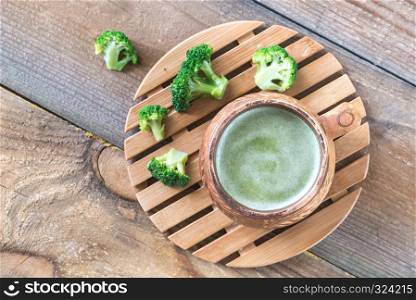 Cup of broccoli coffee with broccoli florets