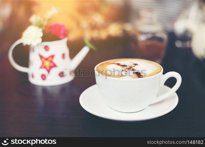 Cup of cappuccino at coffee shop background. 