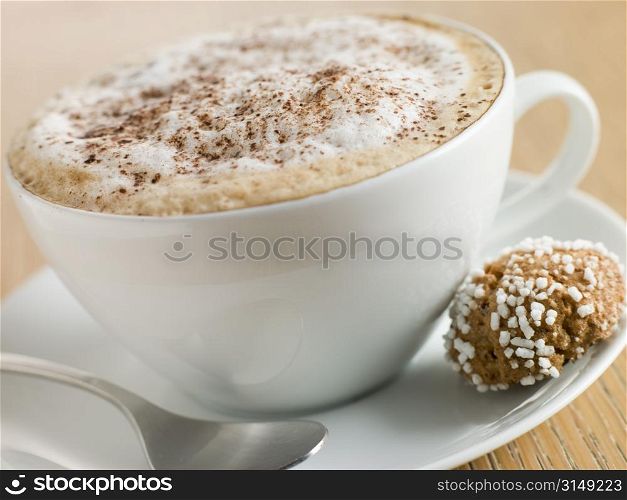 Cup of Cappucino with an Amaretti Biscuit