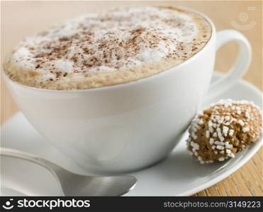 Cup of Cappucino with an Amaretti Biscuit