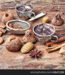 Cup of cocoa,coffee, spices and chocolate truffles