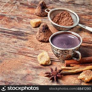Cup of cocoa,coffee, spices and chocolate truffles