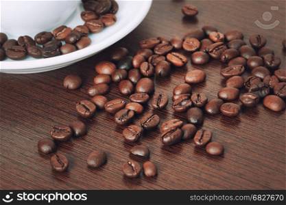 Cup of coffe beans on a table