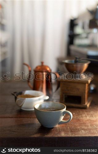 Cup of coffee americano on wood bar.  