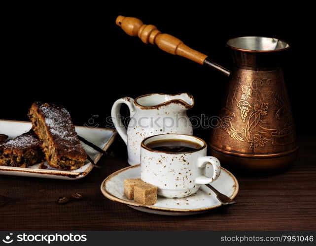 Cup of coffee and a slice of chocolate cake