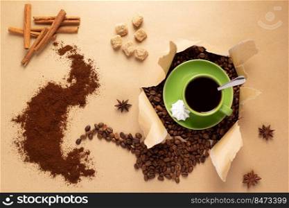 Cup of coffee and beans in paper background. Relax coffee concept