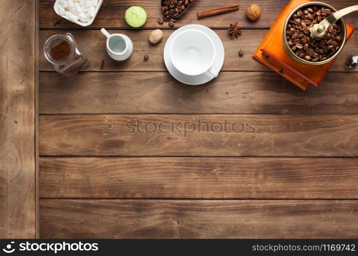 cup of coffee and beans on wooden background table, top view