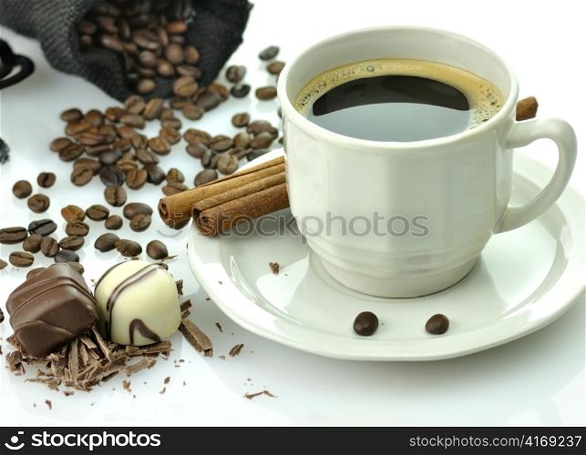 cup of coffee and chocolate candies