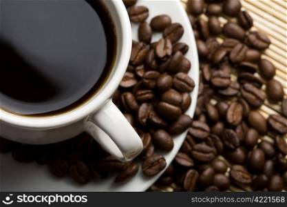 cup of coffee and coffee beans