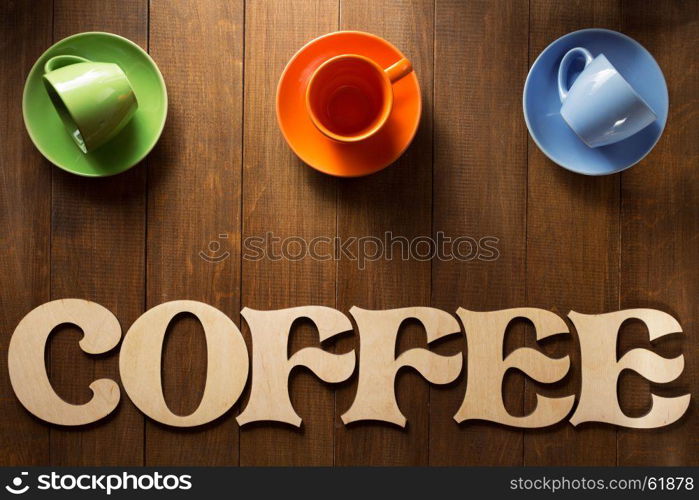 cup of coffee and letters on wooden background