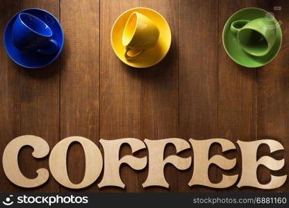 cup of coffee and letters on wooden background