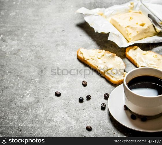 Cup of coffee and sandwiches. On the stone table.. Cup of coffee and sandwiches. On stone table.