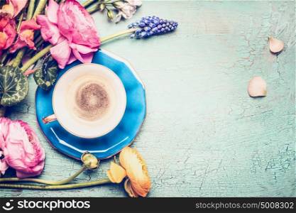 Cup of coffee and summer flowers from garden on blue vintage shabby chic background, top view, copy space