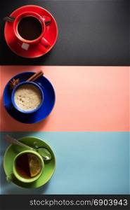 cup of coffee and tea at abstract colorful background