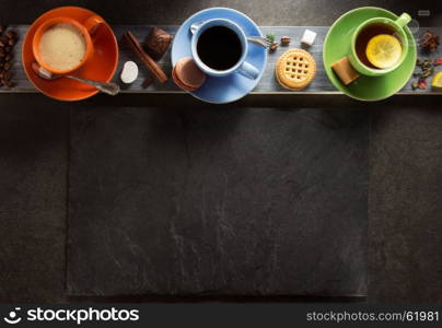 cup of coffee and tea on wooden background