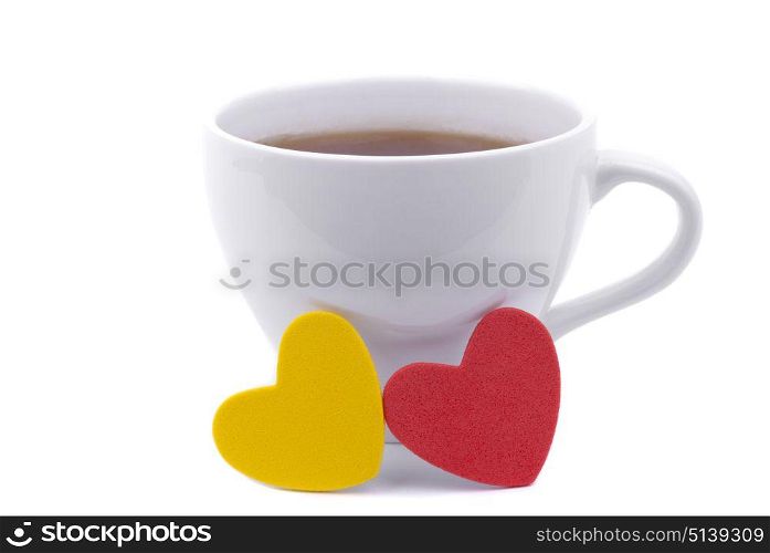 Cup of coffee and two hearts on a white background.