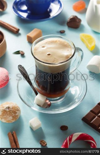 cup of coffee at blue paper background
