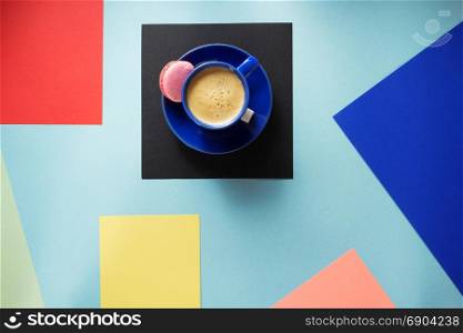 cup of coffee at colorful paper background