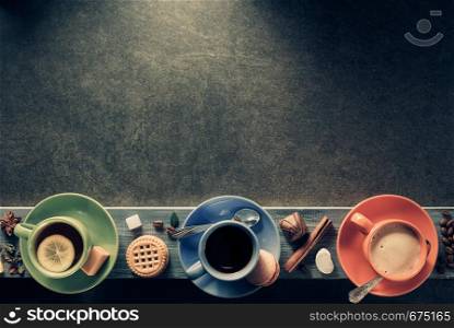 cup of coffee, cacao and tea at table