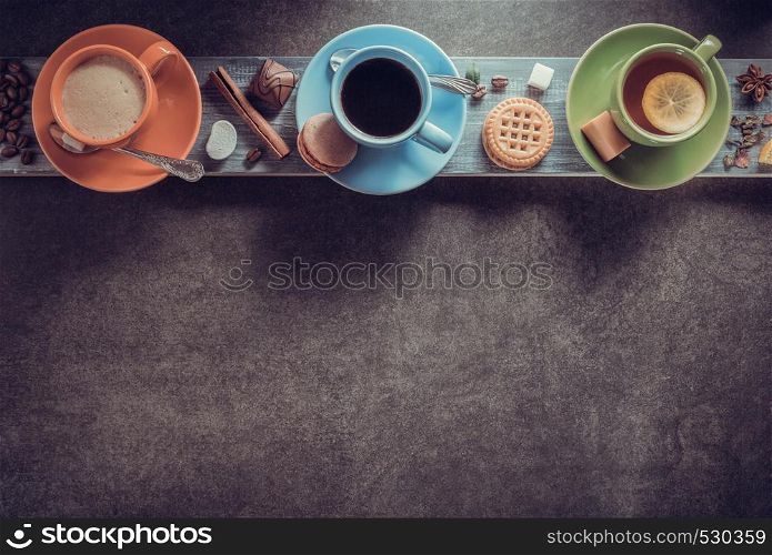cup of coffee, cacao and tea on table background