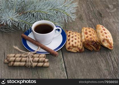 cup of coffee, cookies and fir-tree branch