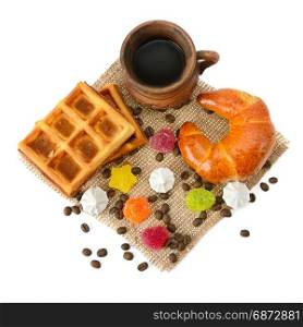 Cup of coffee, croissant, waffles and marmalade isolated on white background.