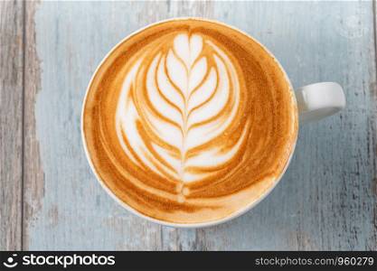 Cup of coffee latte on wooden background. cup of coffee