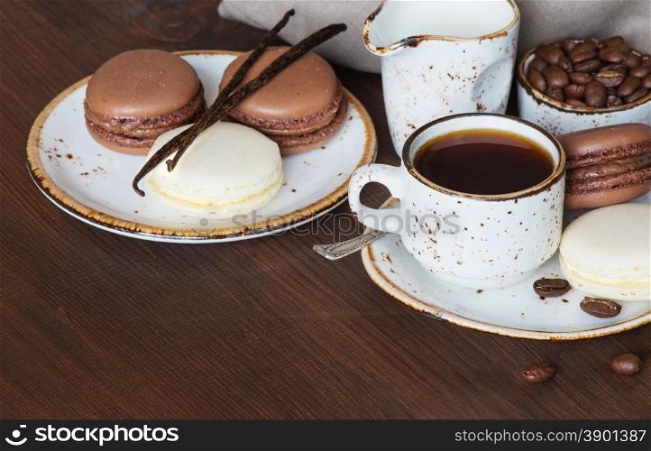 Cup of coffee, macaroons and linen napkin