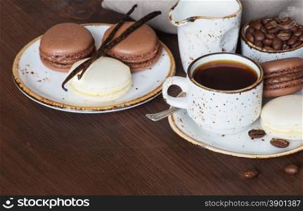 Cup of coffee, macaroons and linen napkin