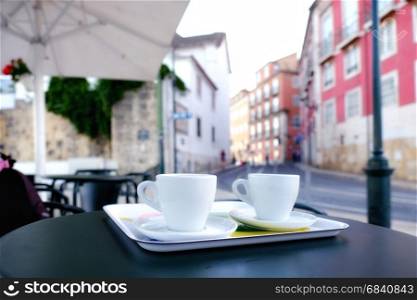 Cup of coffee old european cityscape