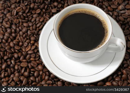 cup of coffee on a background coffee grains