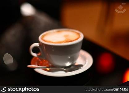 cup of coffee on black table in cafee