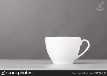 cup of coffee on gray background