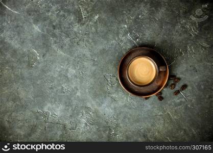 Cup of coffee on rustic background with space for text, flat lay. Cup of fresh coffee on rustic background