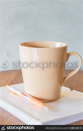 Cup of coffee on simply work table, stock photo