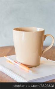 Cup of coffee on simply work table, stock photo