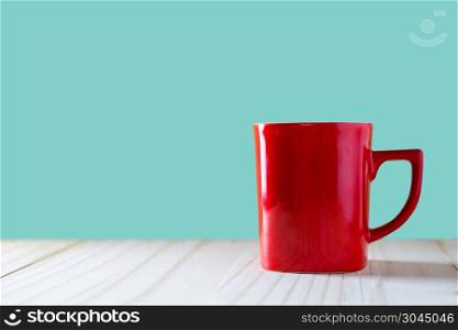 Cup of coffee on wood background