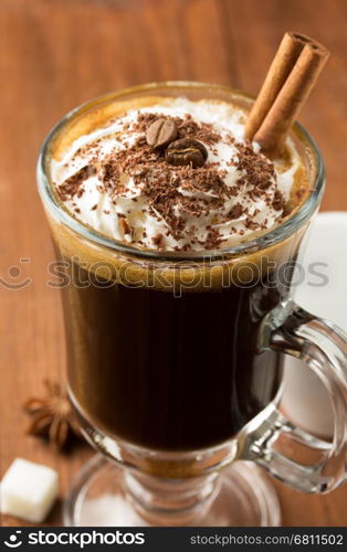 cup of coffee on wooden background