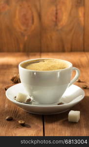 cup of coffee on wooden background