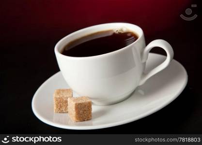 cup of coffee over black background