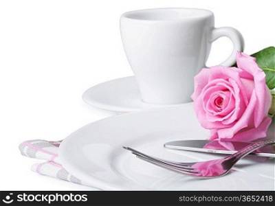 Cup of coffee, silverware, rose and plate on a white background