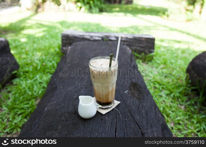 cup of coffee syrup, place the side. On a piece of wood in the garden