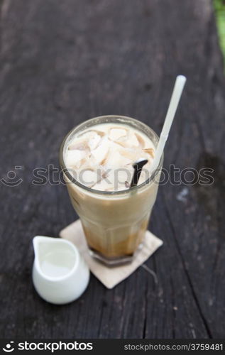 cup of coffee syrup, place the side. On a piece of wood in the garden