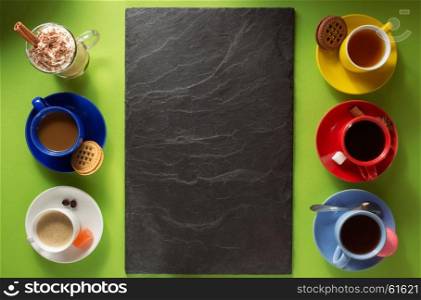 cup of coffee, tea and cacao at paper colorful background