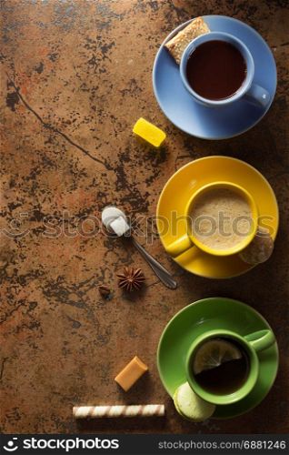 cup of coffee, tea and cacao at table