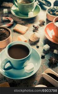 cup of coffee, tea and cacao at table background