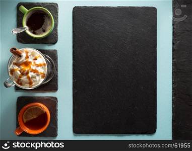 cup of coffee, tea and frappe at paper colorful background