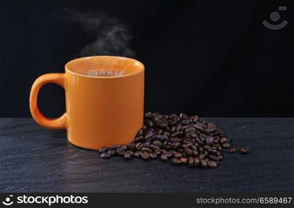 Cup of coffee with a coffee beans.