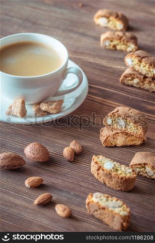 Cup of coffee with cantuccini cookies flat lay