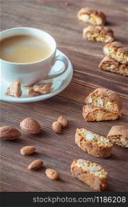 Cup of coffee with cantuccini cookies flat lay